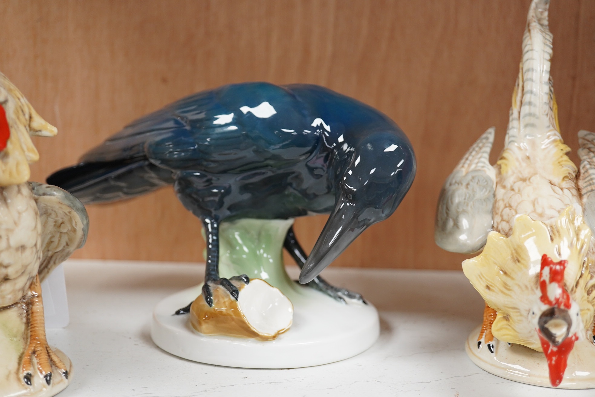 A large Beswick grey parrot, two chickens and a blackbird, parrot 29cm high. Condition - chickens glazing worn